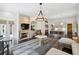 Open-concept living room with a fireplace and a view of the modern kitchen at 2883 Andrews Nw Dr, Atlanta, GA 30305