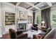 Sophisticated living room featuring custom bookshelves, coffered ceilings, and fireplace at 2883 Andrews Nw Dr, Atlanta, GA 30305