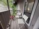 Outdoor balcony with two chairs and table with peaceful, private wooded view at 3915 Woodridge Way, Tucker, GA 30084