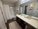Clean bathroom with shower/tub combo, stylish accents, and ample counter space at 3915 Woodridge Way, Tucker, GA 30084