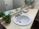 Bathroom featuring a well lit counter with a simple white sink and decor at 3915 Woodridge Way, Tucker, GA 30084