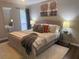 Inviting bedroom featuring a comfortable bed with decorative pillows and lamps at 3915 Woodridge Way, Tucker, GA 30084