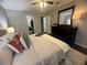 Spacious bedroom with a large bed, stylish decor, and ample natural light at 3915 Woodridge Way, Tucker, GA 30084