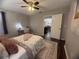 Bedroom featuring ceiling fan, writing desk, decor, and doorway leading to next room at 3915 Woodridge Way, Tucker, GA 30084