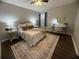 Bedroom with a ceiling fan and decorative area rug and a writing desk with decor at 3915 Woodridge Way, Tucker, GA 30084