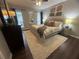 Comfortable bedroom with hardwood floors, dresser, and decorative accents at 3915 Woodridge Way, Tucker, GA 30084