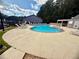 Enjoy the sunshine at this community pool with lounge chairs and manicured landscaping at 3915 Woodridge Way, Tucker, GA 30084