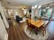 Well-lit dining room with a vintage wooden table, chandelier, and open view of the living spaces at 3915 Woodridge Way, Tucker, GA 30084