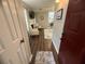 Inviting entryway with hardwood floors leading into a living room with neutral tones and stylish decor at 3915 Woodridge Way, Tucker, GA 30084