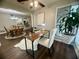 Bright home office space with a wooden desk, fur rug, and a view towards the kitchen at 3915 Woodridge Way, Tucker, GA 30084