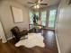 Stylish home office with lots of natural light, a faux fur rug and modern decor at 3915 Woodridge Way, Tucker, GA 30084