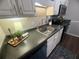 Well-maintained kitchen featuring updated appliances and a deep stainless steel sink at 3915 Woodridge Way, Tucker, GA 30084