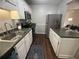 Cozy kitchen featuring stainless steel appliances, white cabinets, and an eat-in counter at 3915 Woodridge Way, Tucker, GA 30084