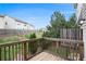 Backyard view from wooden deck with mature trees and partial fencing at 931 Society Cir, Atlanta, GA 30331
