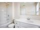 Bathroom featuring white vanity, toilet and tub with shower at 931 Society Cir, Atlanta, GA 30331