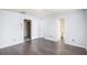 Spacious bedroom with laminate floors and three doors at 931 Society Cir, Atlanta, GA 30331