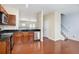Modern kitchen with stainless steel appliances, wood cabinets, and hardwood floors at 931 Society Cir, Atlanta, GA 30331
