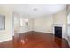 Open living room with hardwood floors, a fireplace, and open access to the kitchen at 931 Society Cir, Atlanta, GA 30331