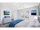 Serene bedroom featuring hardwood floors, a large window, and calming, neutral paint at 931 Society Cir, Atlanta, GA 30331