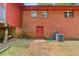 Brick home with a back door, small lawn, and AC unit at 1630 Park Ln, Marietta, GA 30066
