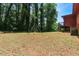 Spacious backyard with swing set and wooded views at 1630 Park Ln, Marietta, GA 30066