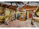 Unfinished basement with concrete floors, storage and ladders at 1630 Park Ln, Marietta, GA 30066