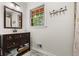 Bathroom with dark vanity and updated lighting at 1630 Park Ln, Marietta, GA 30066