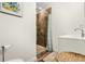 Bathroom with a vanity, a shower stall with brown tile and wood look floors at 1630 Park Ln, Marietta, GA 30066