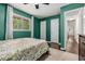 Bedroom with green walls, natural light, and dark wood floors at 1630 Park Ln, Marietta, GA 30066