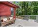 Exterior view of the deck with wooded backyard and wicker seating at 1630 Park Ln, Marietta, GA 30066