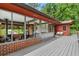 Large deck with screened in porch and wicker seating overlooking backyard at 1630 Park Ln, Marietta, GA 30066
