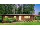 Charming brick home with well-maintained lawn and mature trees offering a serene setting at 1630 Park Ln, Marietta, GA 30066