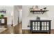 Hallway view with hardwood floors and decorative console table at 1630 Park Ln, Marietta, GA 30066