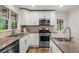 Well-appointed kitchen with granite countertops and stainless steel appliances at 1630 Park Ln, Marietta, GA 30066