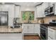 Modern kitchen featuring stainless appliances, granite counters, and ample cabinet space at 1630 Park Ln, Marietta, GA 30066