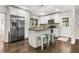 Stylish kitchen with stainless steel appliances, granite counters, and breakfast bar seating at 1630 Park Ln, Marietta, GA 30066