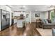 Open-concept living space showcasing a modern kitchen with stainless steel appliances and a comfortable living area at 1630 Park Ln, Marietta, GA 30066