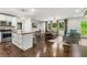 Open-concept living space with kitchen island, dining area, and seating for modern living at 1630 Park Ln, Marietta, GA 30066