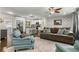 Stylish living room featuring hardwood floors, modern furnishings, and an open layout connecting to the kitchen at 1630 Park Ln, Marietta, GA 30066