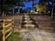 Exterior photo of backyard steps lit with landscape lighting at 1745 Habersham Marina Rd, Cumming, GA 30041