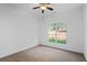 Bright, carpeted bedroom with large window view of backyard at 1745 Habersham Marina Rd, Cumming, GA 30041