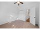 Neutral bedroom featuring carpet, a ceiling fan, a closet, and a doorway to another room at 1745 Habersham Marina Rd, Cumming, GA 30041