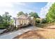 Beautiful exterior view of the home, showcasing its well-maintained yard and mature trees at 1745 Habersham Marina Rd, Cumming, GA 30041
