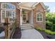 Exterior view of the entrance of a home with well-manicured landscaping at 1745 Habersham Marina Rd, Cumming, GA 30041