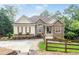 Charming home featuring stone accents, well-manicured landscaping, and a welcoming entrance at 1745 Habersham Marina Rd, Cumming, GA 30041