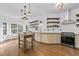 Modern kitchen with stainless steel appliances, open shelving, and ample counter space at 1745 Habersham Marina Rd, Cumming, GA 30041