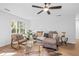 Inviting living room featuring a comfortable sectional sofa and natural light at 1745 Habersham Marina Rd, Cumming, GA 30041