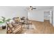 Living room featuring modern furniture, light hardwood floors, and bright, white walls at 1745 Habersham Marina Rd, Cumming, GA 30041