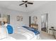 Main bedroom with tray ceiling, ceiling fan and ensuite bathroom at 1745 Habersham Marina Rd, Cumming, GA 30041