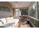 Cozy screened-in porch featuring a daybed and comfortable seating at 1745 Habersham Marina Rd, Cumming, GA 30041